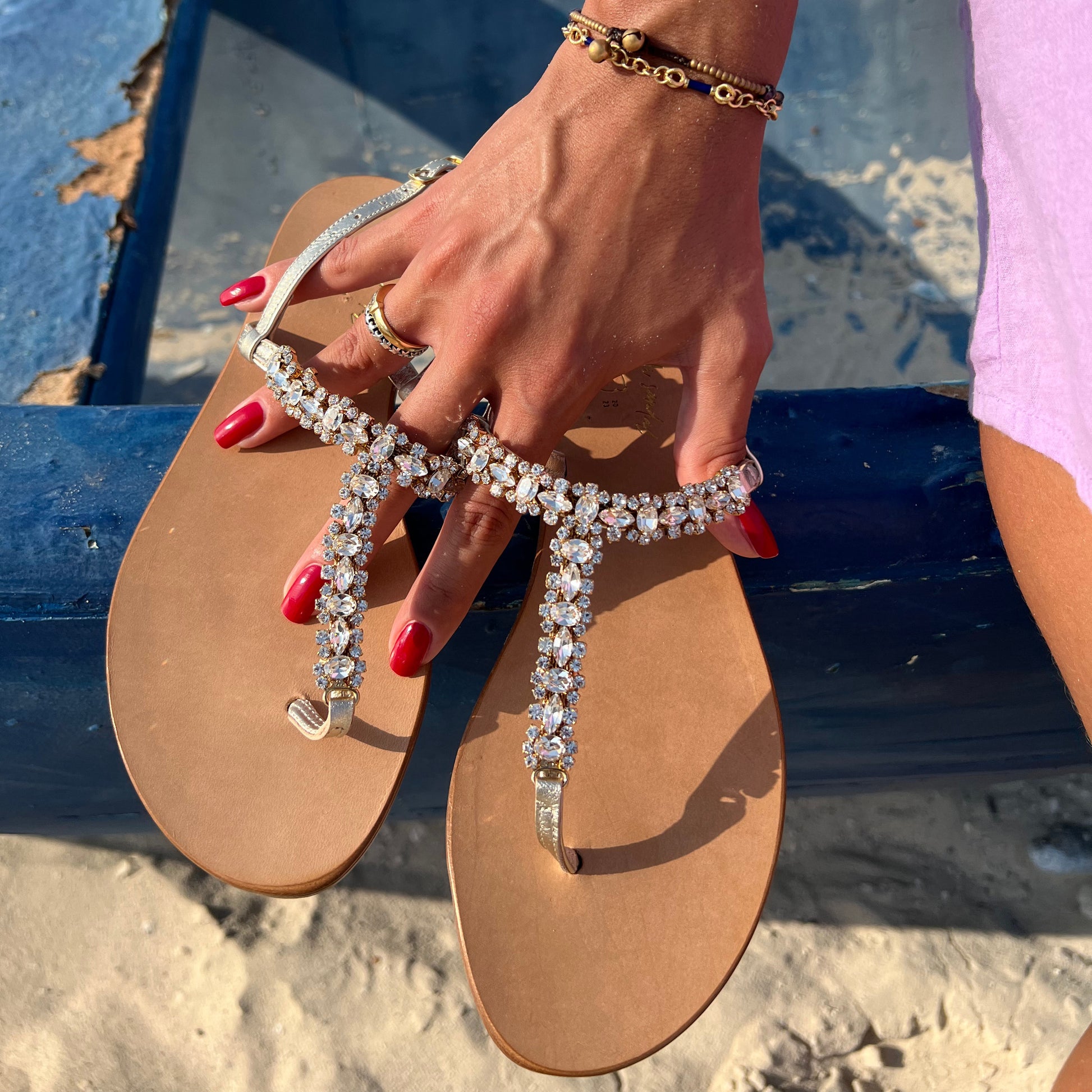 Amalafi Sandal "STELLA" | Color White Crystals & Gold | Italian Leather Sandal |Handmade in Italy | What makes the “STELLA” sandal truly special is the way the Swarovski crystals sparkle and shine in the light, creating a dazzling effect that is sure to impress. Whether you wear them during the day or at night, the “STELLA” sandal is a true statement piece.